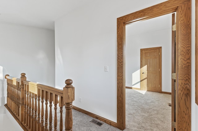 hallway with light carpet