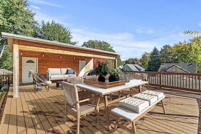 wooden terrace featuring outdoor lounge area