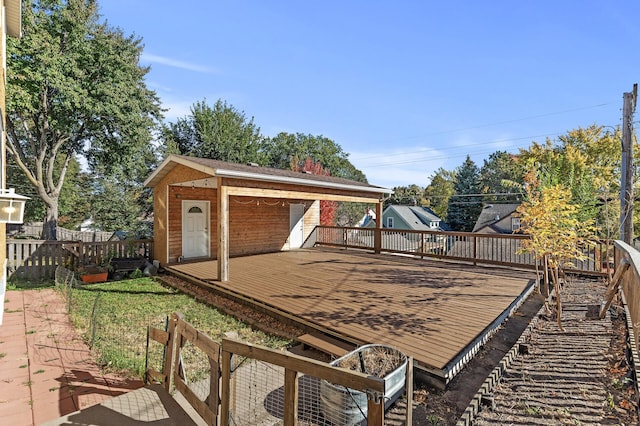 view of yard featuring a deck and an outbuilding