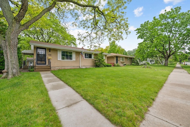 ranch-style house featuring a front lawn