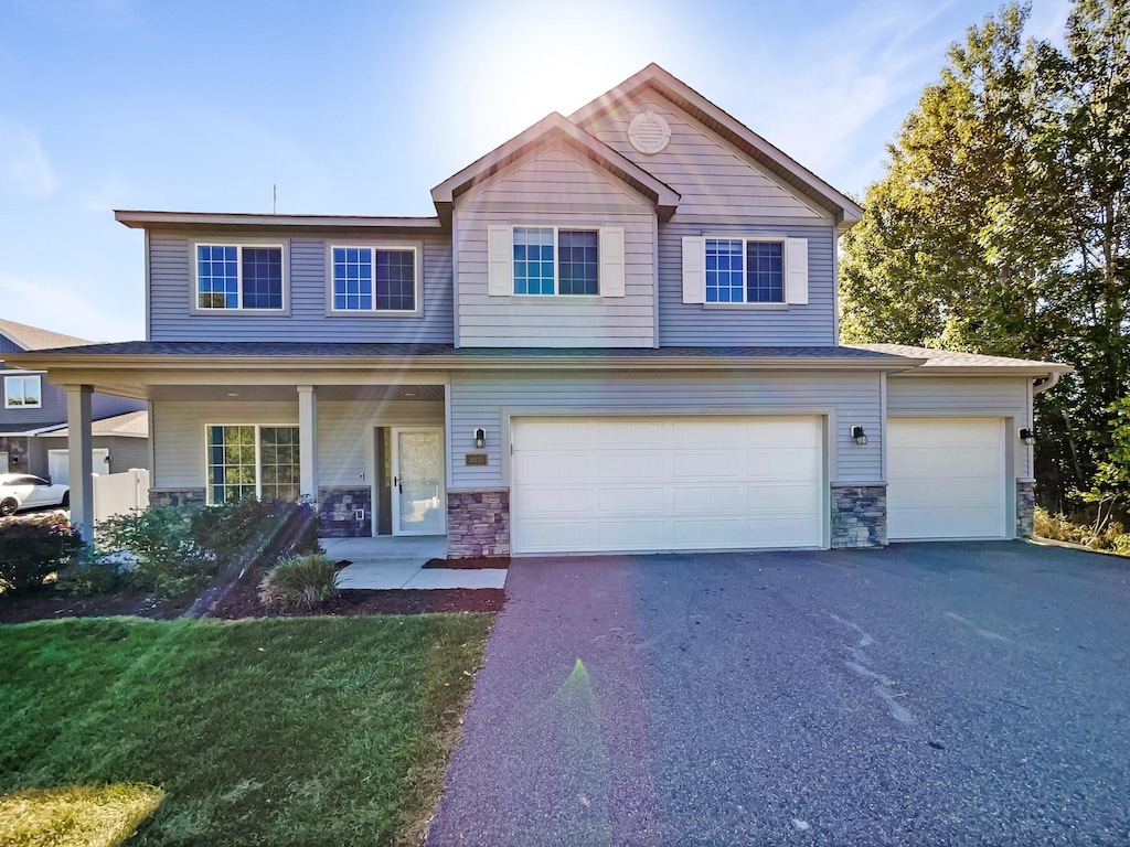 view of front of house featuring a front yard and a garage