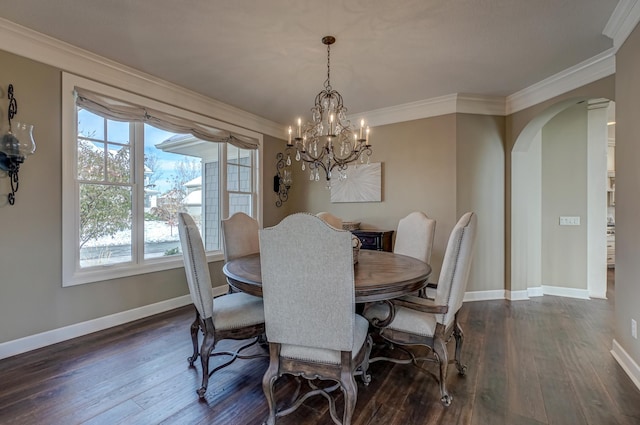 dining area featuring ornamental molding, a chandelier, and dark hardwood / wood-style floors