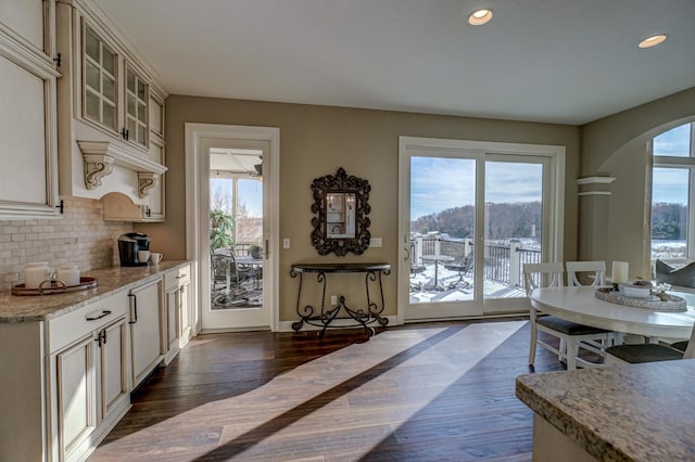 interior space with dark hardwood / wood-style flooring