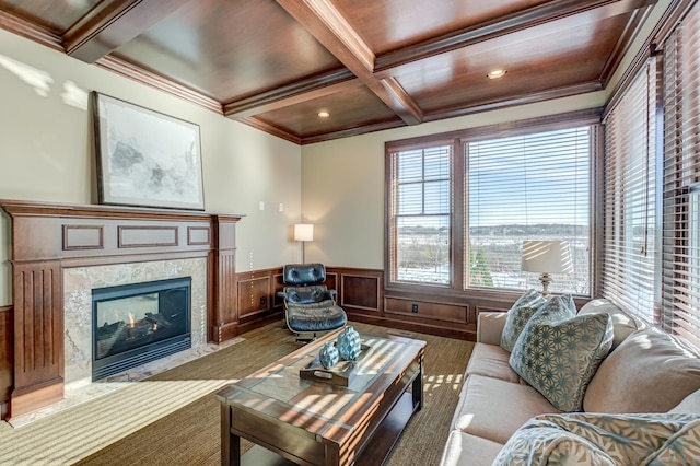 living room with crown molding, coffered ceiling, beam ceiling, and a fireplace