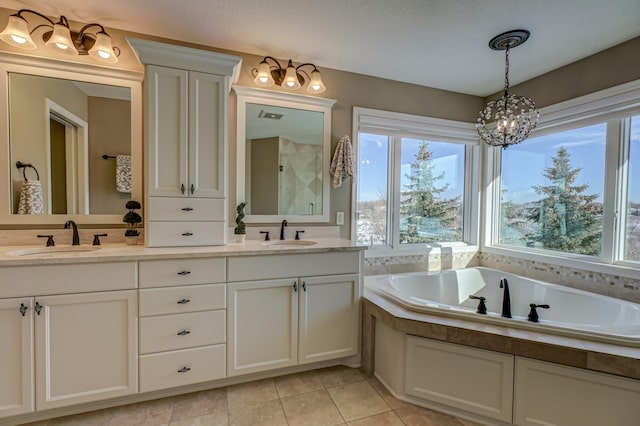 bathroom with vanity, separate shower and tub, an inviting chandelier, and tile patterned flooring