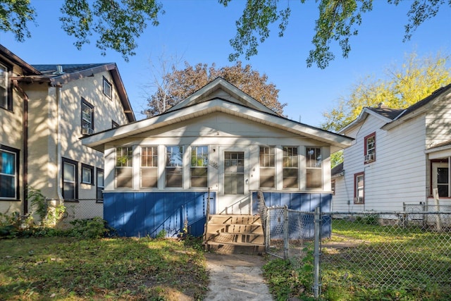 view of front of house featuring a sunroom