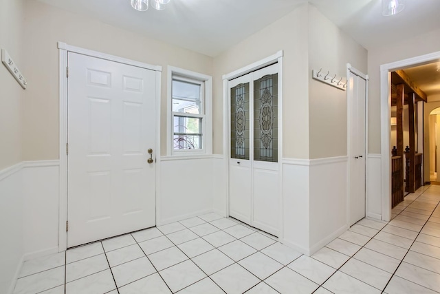 entryway with light tile patterned floors