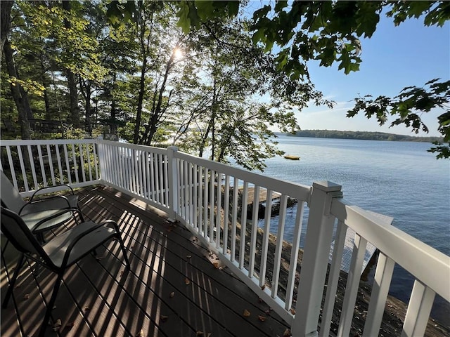 wooden deck featuring a water view