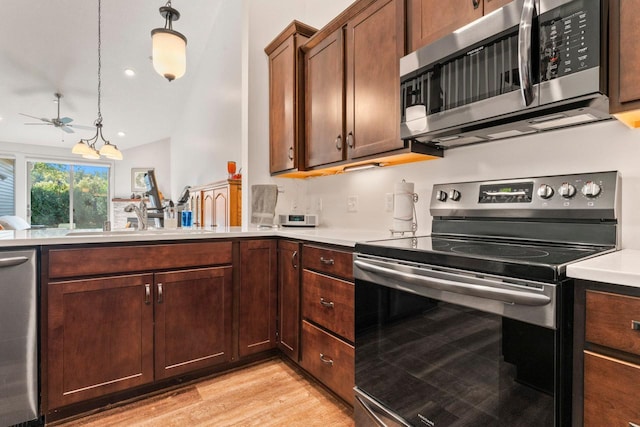 646 Shardlow Pl NE, Byron, MN 55920 - kitchen with a ceiling fan, a sink, light wood-type flooring, light countertops, and appliances with stainless steel finishes