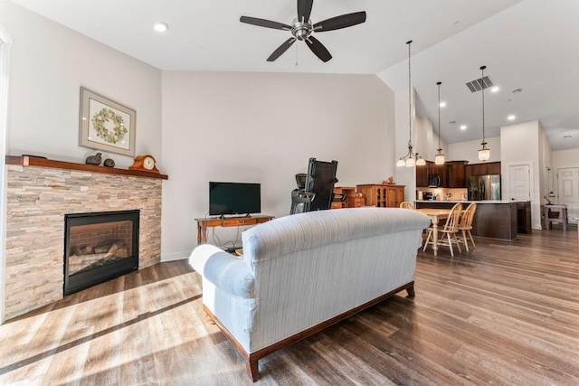 646 Shardlow Pl NE, Byron, MN 55920 - living room with a fireplace, a ceiling fan, visible vents, and wood finished floors