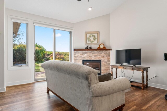 646 Shardlow Pl NE, Byron, MN 55920 - living room with lofted ceiling, baseboards, a fireplace, and wood finished floors
