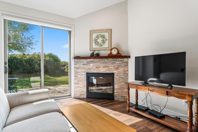 646 Shardlow Pl NE, Byron, MN 55920 - living room with vaulted ceiling, a stone fireplace, and wood finished floors