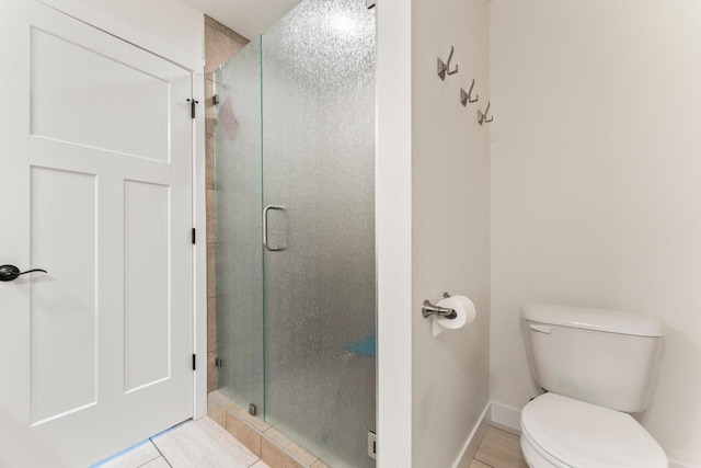 646 Shardlow Pl NE, Byron, MN 55920 - full bathroom featuring toilet, baseboards, and a shower stall