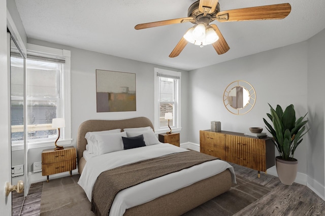 bedroom featuring ceiling fan and hardwood / wood-style floors