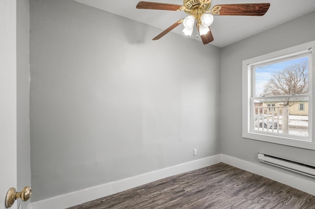 empty room with ceiling fan, hardwood / wood-style floors, and baseboard heating