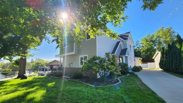 view of side of property featuring a yard