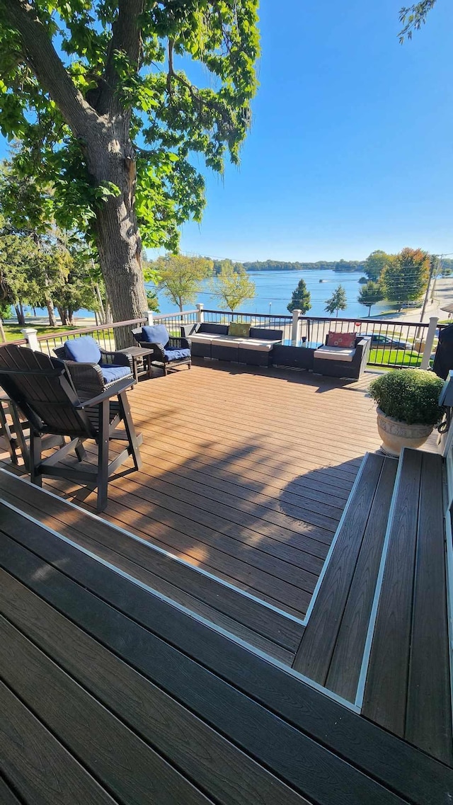 wooden terrace with a water view