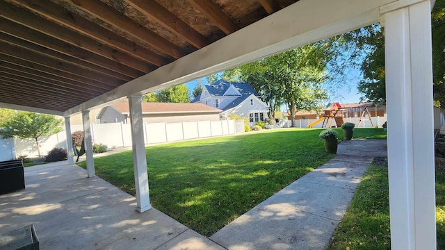 view of yard with a patio area and a playground