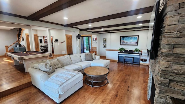 living room featuring wood-type flooring, beamed ceiling, and billiards