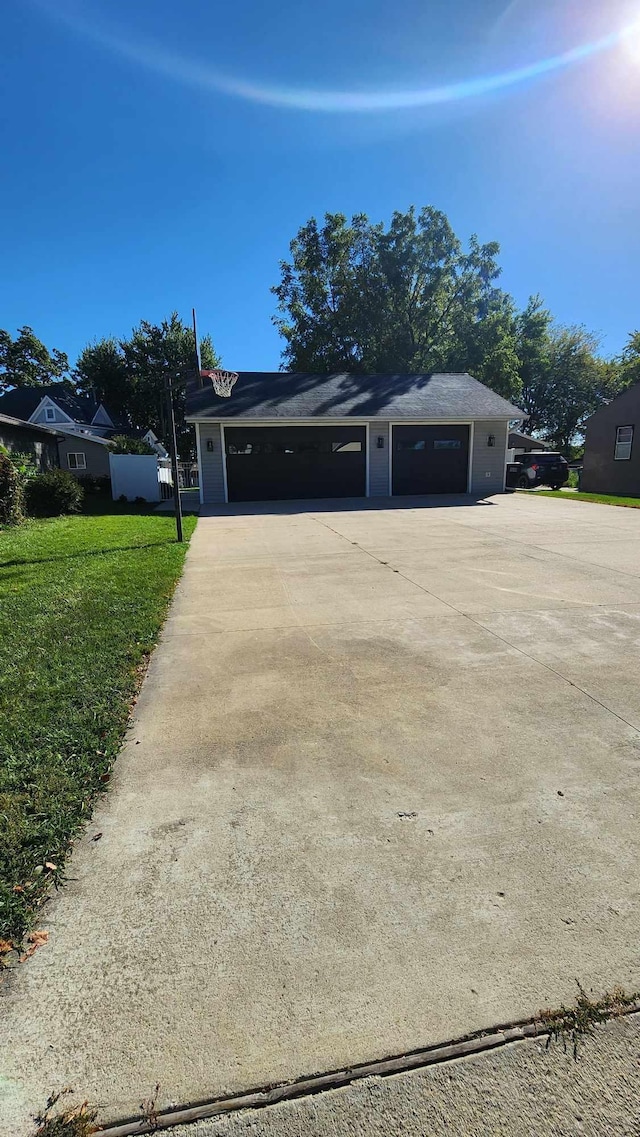 exterior space featuring a front yard and a garage