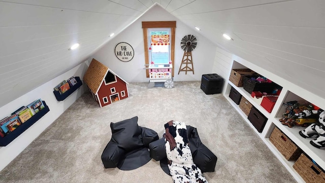 playroom with lofted ceiling and carpet flooring