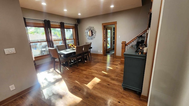 dining area with hardwood / wood-style floors