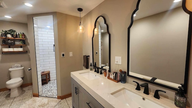 bathroom with tile patterned floors, vanity, and toilet