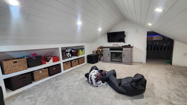 game room featuring light carpet, lofted ceiling, and wooden ceiling