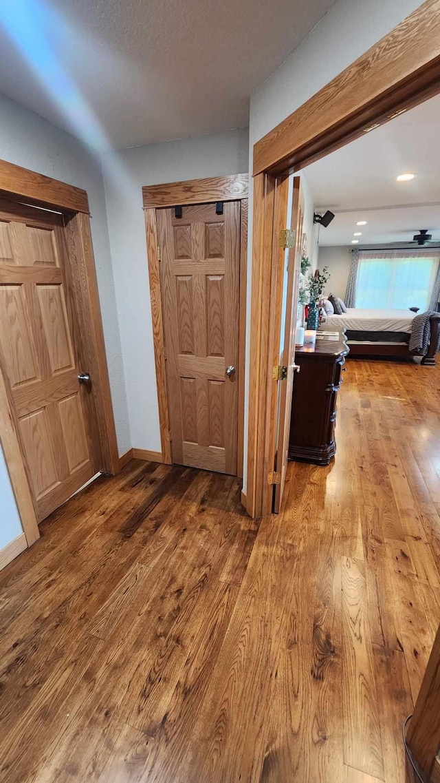 hallway with light hardwood / wood-style flooring