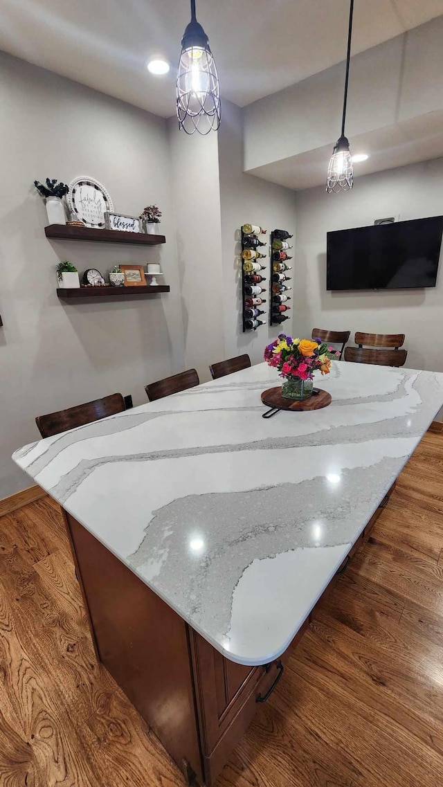 dining space with dark hardwood / wood-style flooring