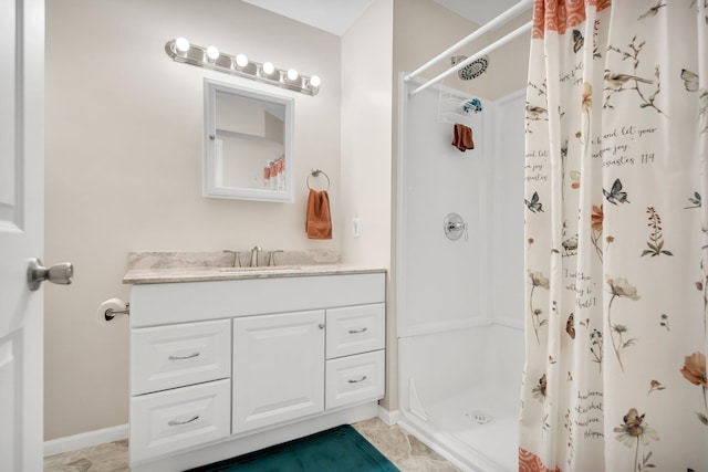 bathroom with tile patterned flooring, vanity, and curtained shower