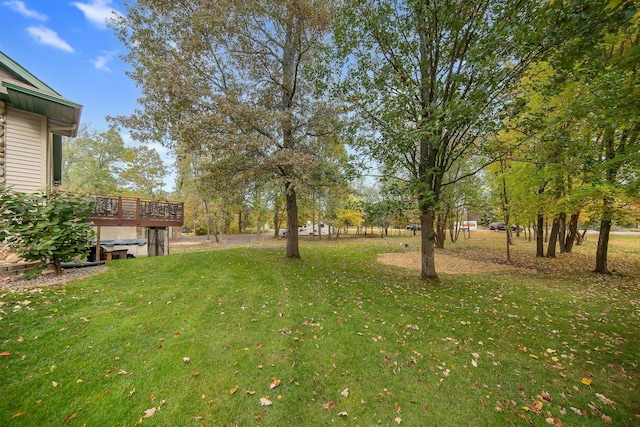 view of yard featuring a wooden deck