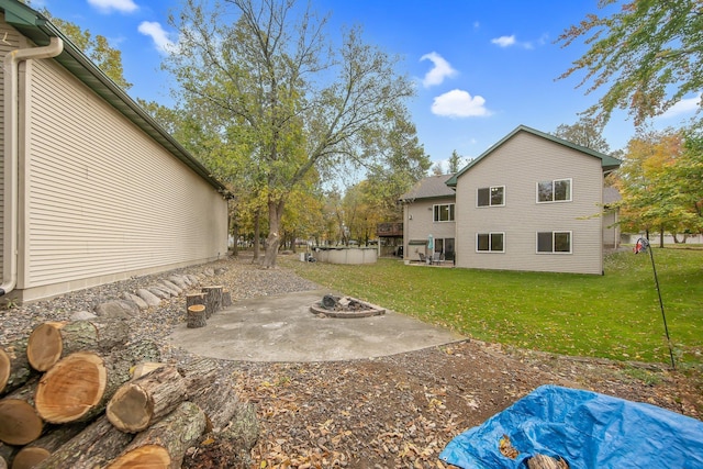 view of yard featuring a patio and a fire pit