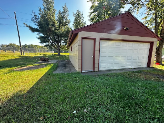 garage featuring a lawn