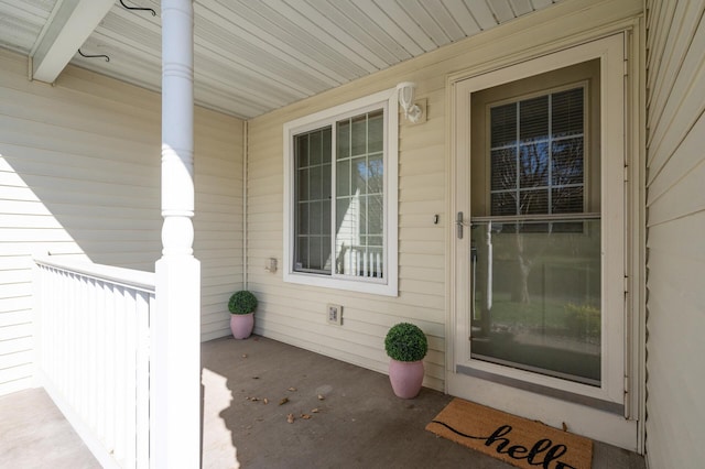 entrance to property featuring a porch