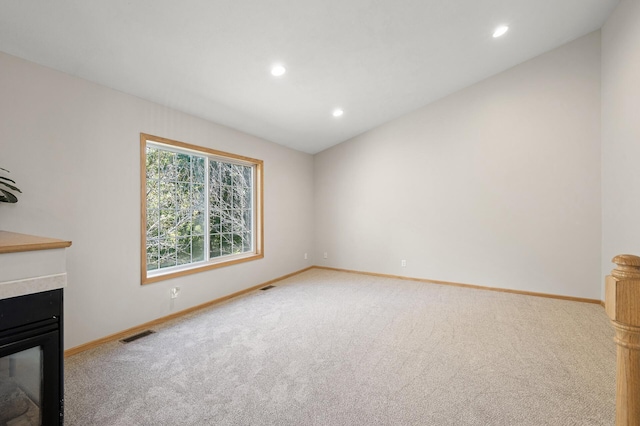 unfurnished living room featuring carpet