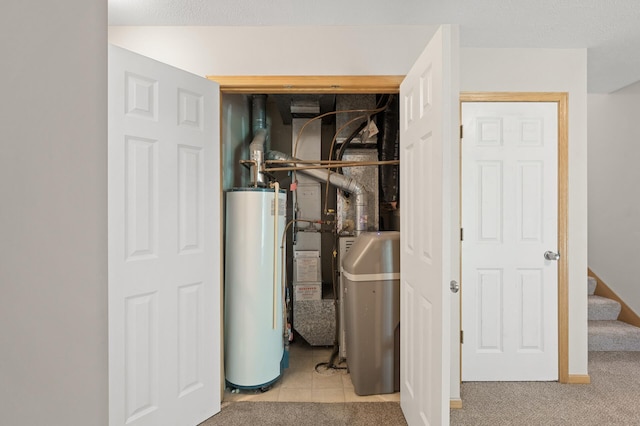 utility room featuring gas water heater