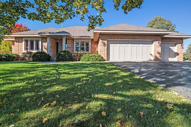 view of front facade with a front lawn and a garage