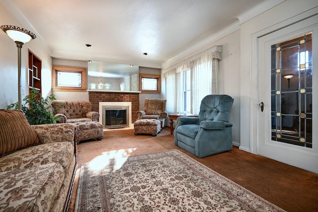 carpeted living room with a brick fireplace