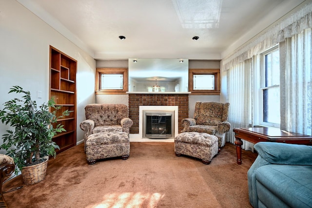 living area featuring a fireplace and carpet flooring