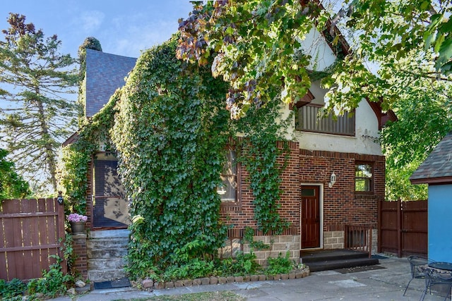 back of house with a patio and a balcony