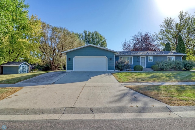 ranch-style house with a garage, a storage shed, and a front lawn