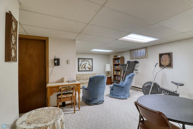 carpeted office featuring a paneled ceiling