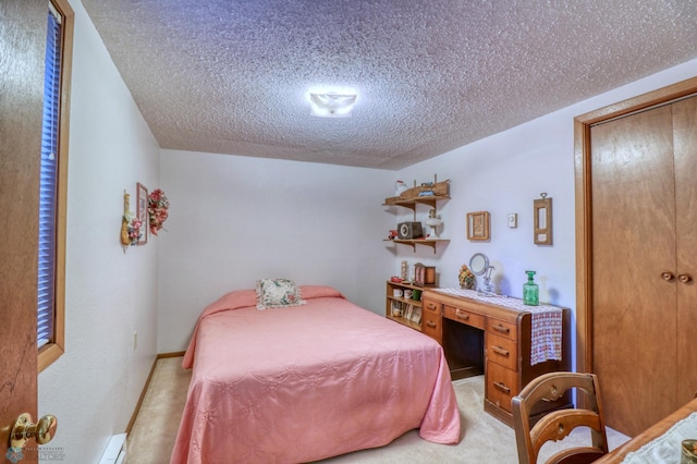 bedroom with a textured ceiling, a baseboard radiator, light carpet, and a closet