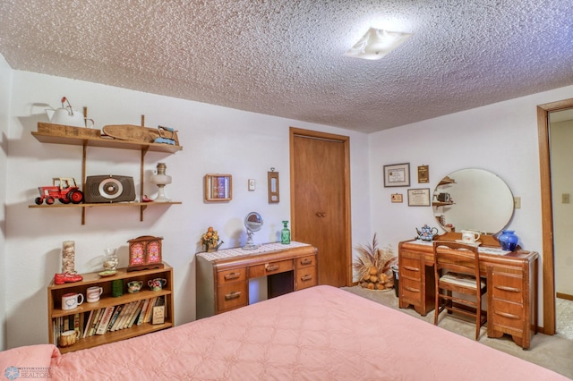 carpeted bedroom with a textured ceiling