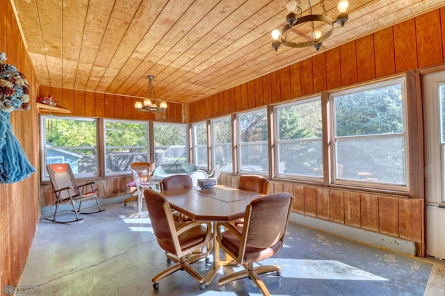 sunroom / solarium featuring a chandelier and wooden ceiling