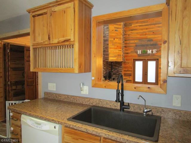 kitchen with sink and white dishwasher