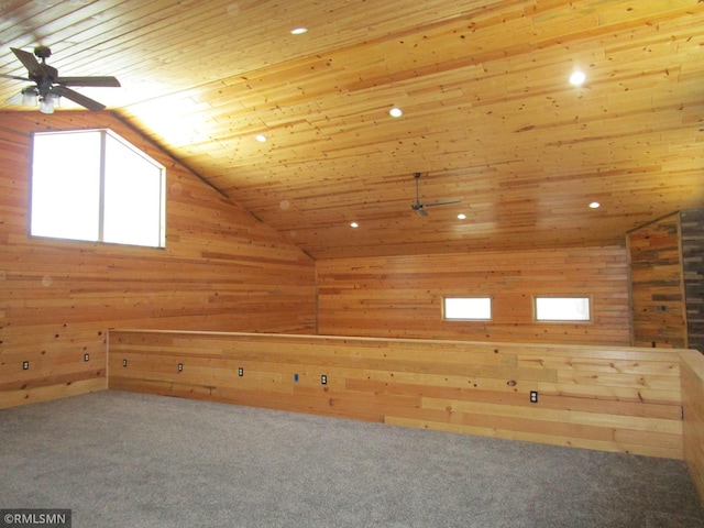 bonus room with wooden walls, lofted ceiling, carpet, ceiling fan, and wooden ceiling