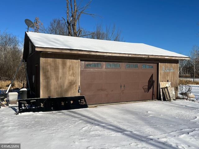 view of snow covered garage