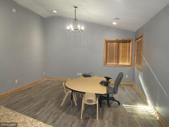 office space featuring recessed lighting, an inviting chandelier, vaulted ceiling, wood finished floors, and baseboards